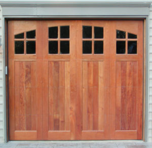bifold style garage door with arched style garage door windows in 4 panels 