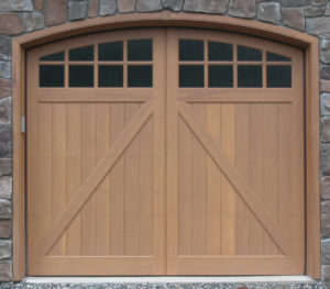 arched style wooden carriage house garage door with two arched window panels 