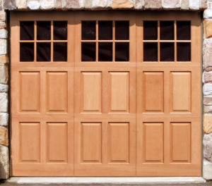 trifold style garage door with three square garage door window panels 