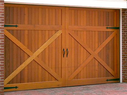 Double door with heart-style decorative strap hinges and pull handles