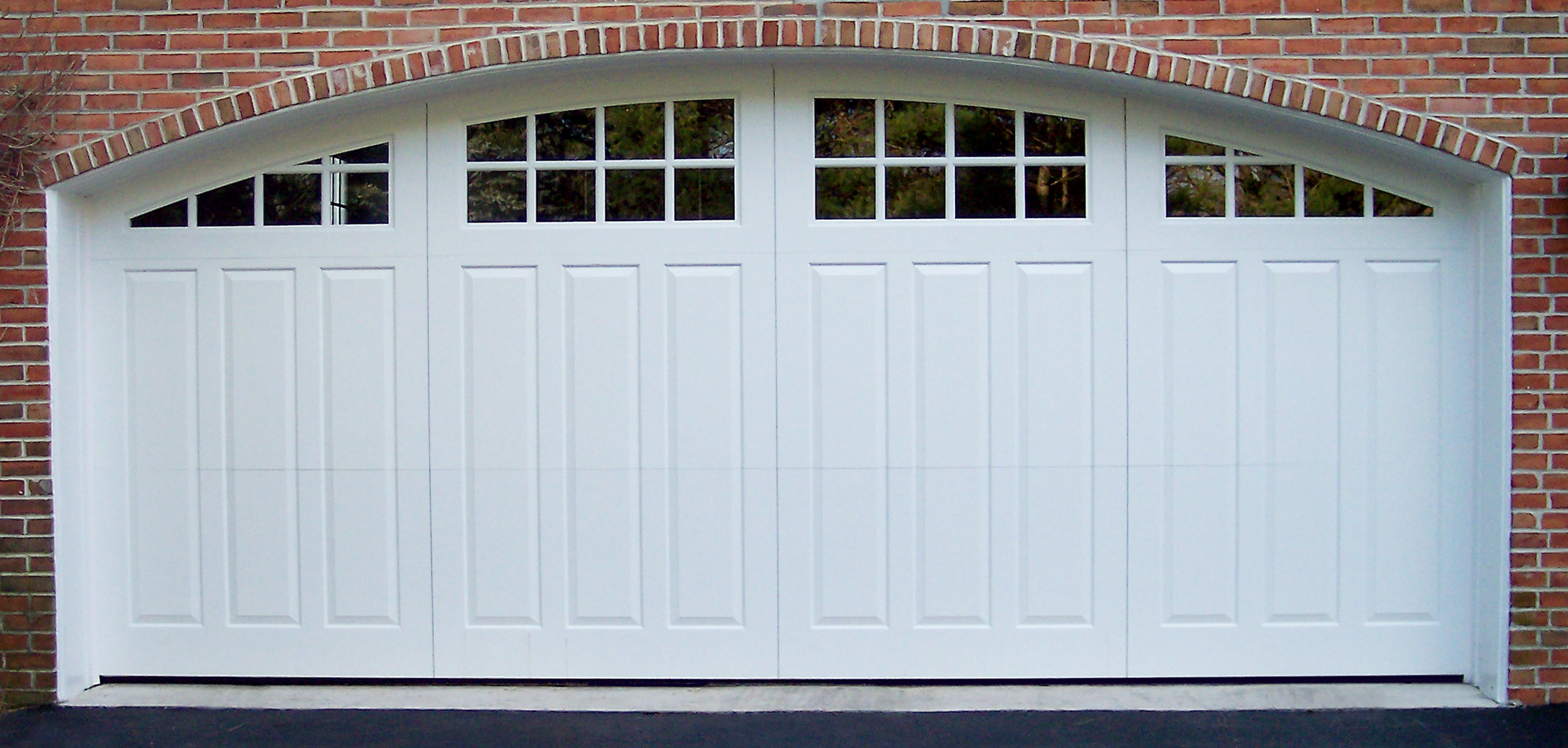 Painted wood, swing-style double door with a custom radius
