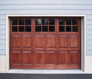 stained garage door with three square window panels
