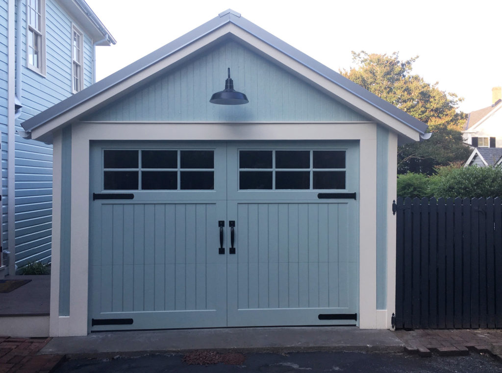 Before & After: image of updated garage door in pale blue with white trim, new windows and overhead light