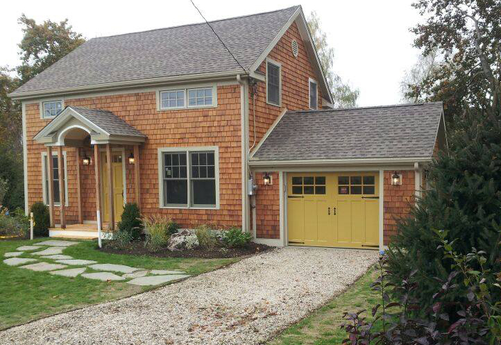 colonial home with new custom carriage house garage door