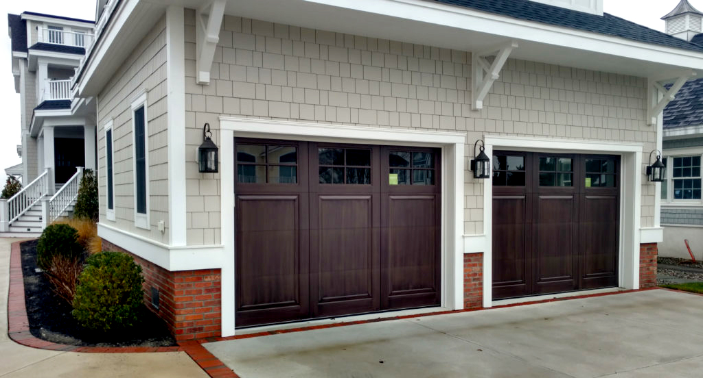 Two brown stained wooden garage doors on a beach house