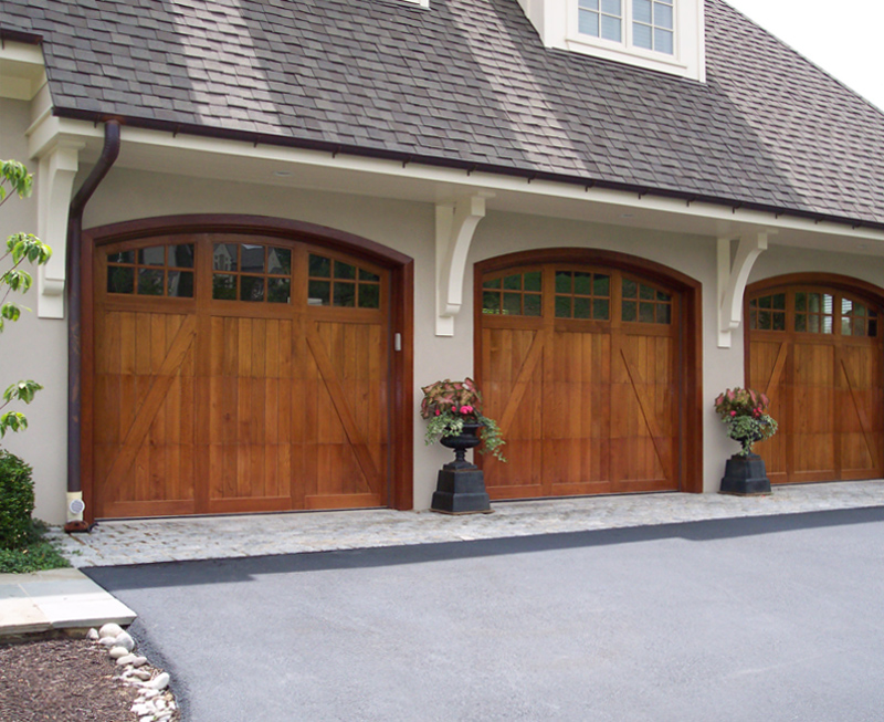Three car garage with real wood garage doors