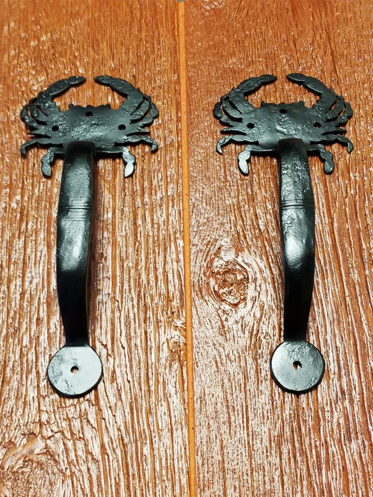 Custom crab garage door handles from Artisan Custom Doorworks