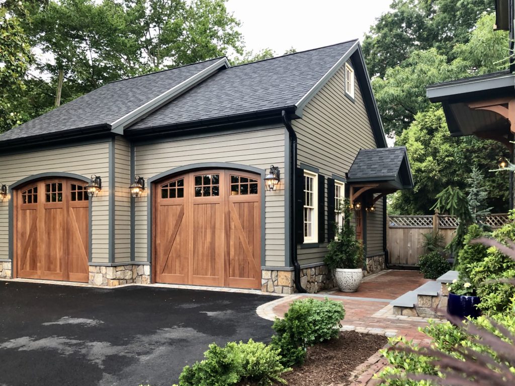 Real wood garage doors installed on an detached two car garage