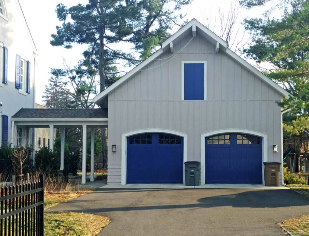 Two garage doors painted cobalt blue.