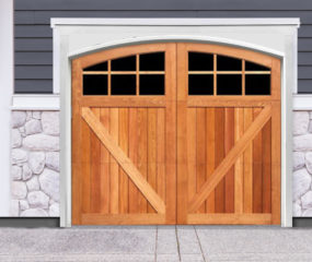 Light brown arched swing out wooden garage door with v buck panels and two windows