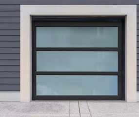 Glass garage door with three black horizontal window panes