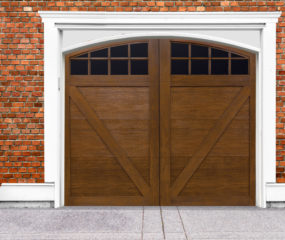 Ash stain finish faux wood garage door with v buck panels and two windows