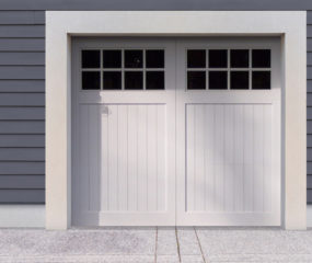 White vinyl carriage house garage door with two panels and windows