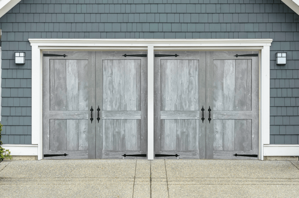 Two grey garage doors with handles 