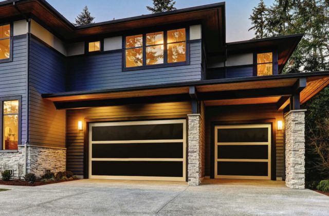 a modern black and gold garage door style that represents the Panorama door series