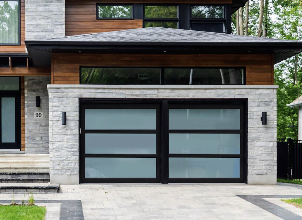 A full glass garage door with black framing. 