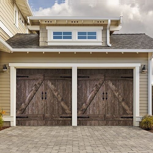 Brown American Farmhouse Garage Door installed on home.