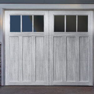 composite wood carriage garage door in white with top windows.
