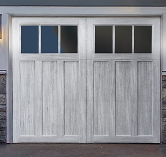 composite wood carriage garage door in white with top windows.