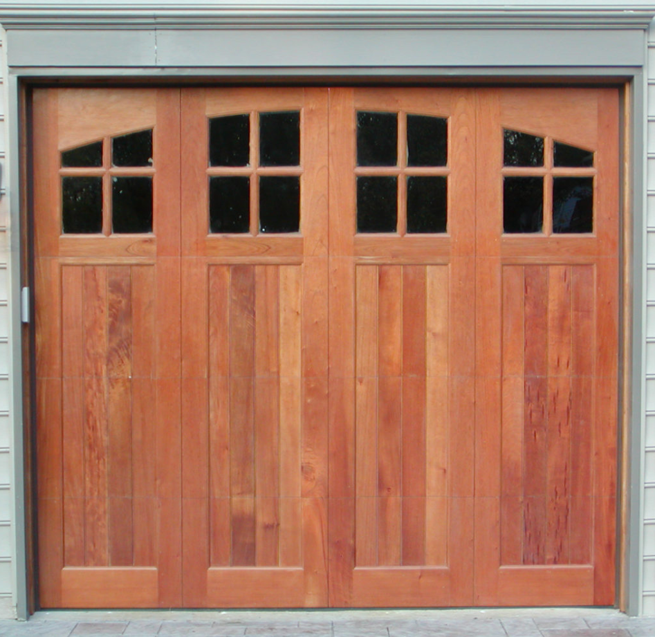 Bifold garage door windows on a wooden garage door