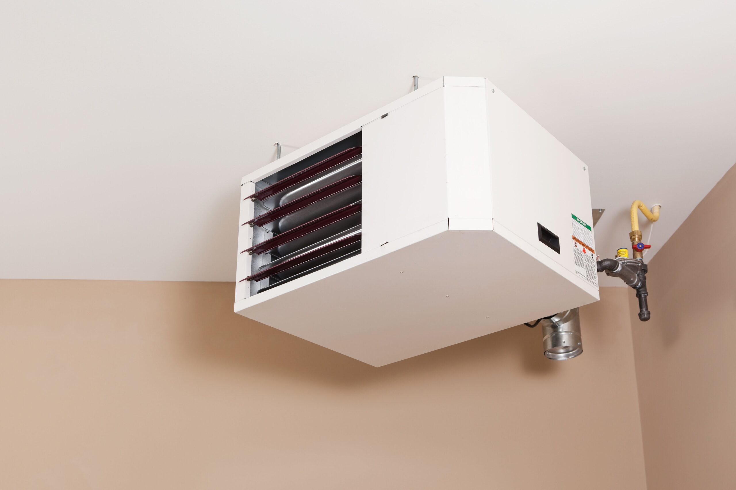 A forced-air heater in a garage.