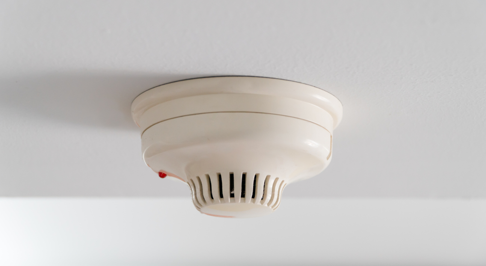 Heat detector on ceiling in garage.