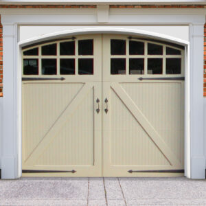 Light beige swing out wooden garage door with windows, door straps, and handles