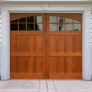 Brown stained wooden swing out carriage garage door with two windows and low cross rail