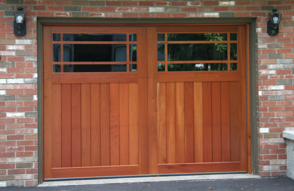 Prairie styled garage door windows on a wooden garage door attached to a brick garage