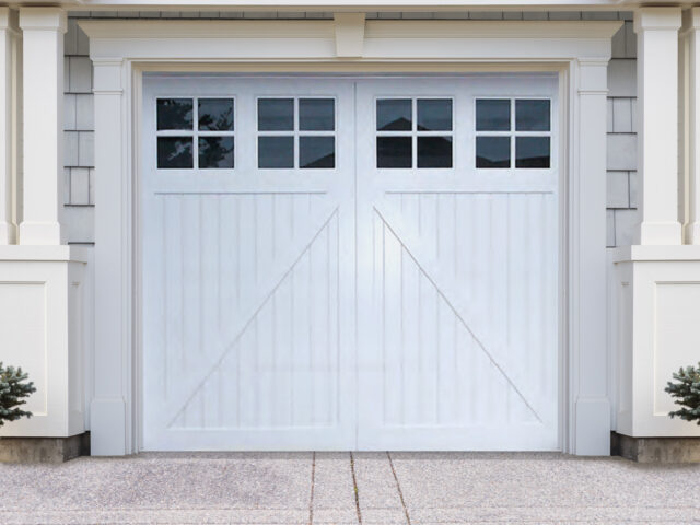 Prelude 2, a white vinyl carriage garage door, from Artisan Custom Doorworks