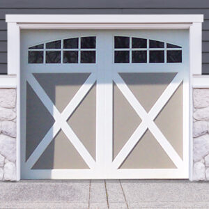 White and gray faux wood garage door with x crossbuck panels and two windows