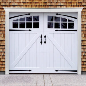 White vinyl carriage garage door with z buck panels, two windows, door straps, and door handles