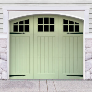 Green vinyl carriage house garage door with three panels and windows with door straps