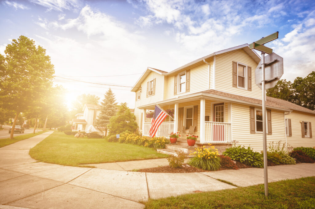 brigh sunlight shining on a neighborhood home
