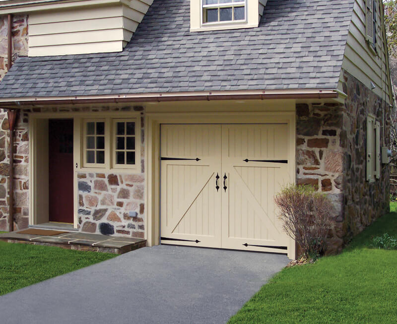 Medallion garage door on stone exterior